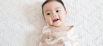 When to stop swaddling baby: Transition out of swaddle