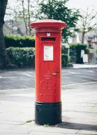 That are delivered to homes or places of work: Red And Black Gr Post Office Letter Container Photo Free Postbox Image On Unsplash