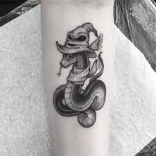 Clara Welsh Clarawelshtattoos I M Gonna Go Out On A Limb And Say This Little Sneke Sne Would Be Slytherin Ta Slytherin Tattoo Tattoos Body Art Tattoos