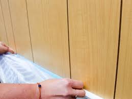 A deglosser is wiped onto the paneling, acting as a liquid sandpaper so the paint will stick. How To Paint Over Wood Panel Walls How Tos Diy