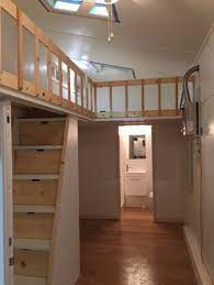 Tiny House On Wheels With Loft Railing Storage Compartments In Stairs Built By Tiny Idahomes Tiny House Loft Tiny House Living Loft Railing