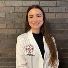 Sarah Krull ('19) was presented with her white coat in a ceremony ...
