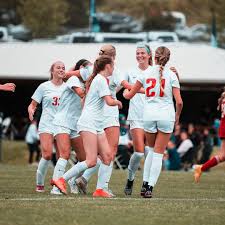 Mustang coach Mary Hoffert guides...