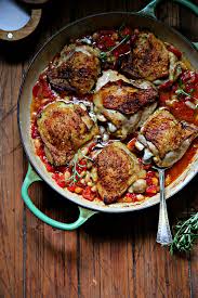 Skillet Chicken Thighs With Fire Roasted Tomatoes And White Beans Recipe Roasted Tomatoes Fire Roasted Tomatoes Recipe Tomato Dishes