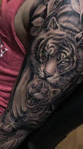 Tiger and cubs tattoo by stefan. Everyday Tattoo Ideas Lion Tattoo Sleeves Tiger Tattoo Sleeve Tiger Face Tattoo