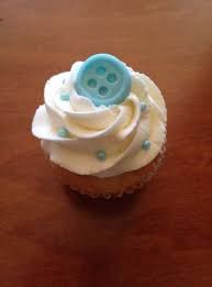 This sweet baby shower cake is iced in buttercream with lots of little buttercream flowers and butterflies, with a precious fondant sleeping baby topper. Baby Shower Cupcakes Buttons 15 Ideas Baby Boy Cupcakes Shower Cupcakes Shower Cakes