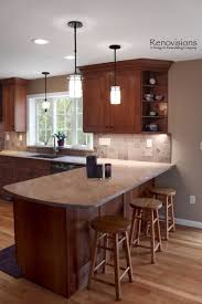 Kitchen Remodel By Renovisions Cherry Cabinets Shaker Cabinets Under Cabinet Lights Tu Kitchen Remodel Small Cherry Cabinets Kitchen Kitchen Remodel Trends