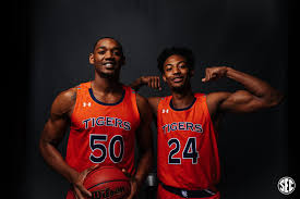 A white jersey with a green trim. New Auburn Basketball Uniforms For 2019 Auburn Uniform Database