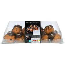 The puffs may be decorated or left plain or garnished with chocolate sauce, caramel, or a dusting of powdered sugar. M S Profiterole Stack Ocado
