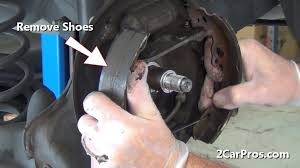 Serial number of two bottom screws: How To Remove And Replace Automotive Rear Brake Shoes And Drums