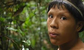 Indigenous man with face mask matching his beautiful traditional attire. 8 Things To Know About Channel 4 S Lost Tribe Of The Amazon Environment The Guardian