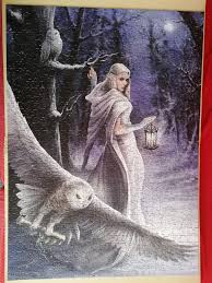 I thought we'd have another owl picture today, so here as the featured art  is "Midnight Messenger". The white witch walks through the winter forest at  night as snow flakes fall around