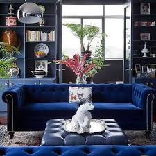 Cabin Living Room With Blue Slipcovered Sofa With Gold Drum End Table Country Living Blue Velvet Sofa Living Room Blue Velvet Sofa Velvet Sofa Living Room