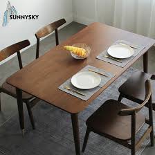 There's a modern fireplace across it that's fixed to the stone brick wall. China Top Dinner Furniture High Quality Dark Wood Dining Table Quotes China Dining Tables Dining Table Set