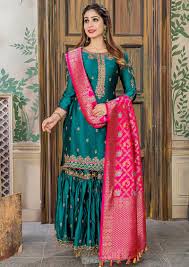 Most peacocks have beautiful iridescent feathers that change color as the light reflects from the feathers. Peacock Green Color Malai Satin Embroidered Party Wear Sharara Suit Ethnicroop
