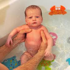 A baby bathtub will help you prop up a wriggling newborn. Baby Bathing In Tub Desicomments Com