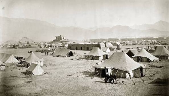Photograph of a group of Afghan prisoners with a Sikh escort, taken by John Burke in 1878.