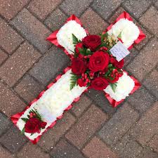 Maybe you would like to learn more about one of these? Red And White Cross Funeral Flowers Tribute Wreath Funeral Flowers Funeral Flower Arrangements Funeral Floral Arrangements