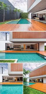 eine grosse holzterrasse umfliesst das schwimmbad die sich aus der hauptwohnbereich dieser brasilianischen heimat swimming pool house pool houses modern pools