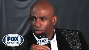 Deion Sanders climbs a mountain