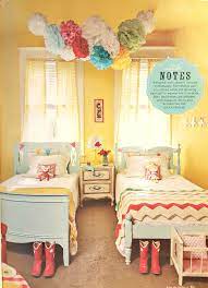 A hopscotch rug ties the room's colors together while also providing a fun game to play. Girl Room Ideas Yellow Novocom Top