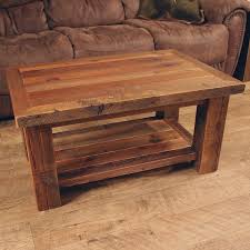 Putting together the table will go faster with a helper. Timber Frame Reclaimed Barnwood Coffee Table
