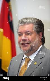 Kurt Beck, prime minister in rhineland-palatinate and SPD Chairman with the  german banner Stock Photo