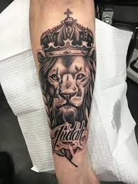 This tattoo is a monster. Black Ink Crown On Lion Head Tattoo On Left Arm