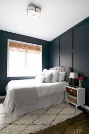 Here, a fun rattan bed frame and colorful tropical bed linens paired against the deep, navy wall give this space a trendy island look. 10 Best Blue Paint Colors For The Bedroom