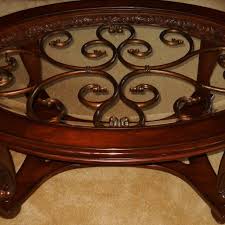 Norcastle coffee table with 2 end tables. Find More Reduced 2 Pc Ashley Furniture Norcastle Dark Brown Collection Oval Cocktail Coffee Table And Round End Table For Sale At Up To 90 Off