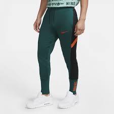 Pantalon survêtement Nike F.C. vert orange sur Foot.fr