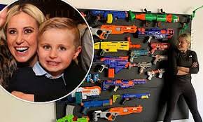 Hand forged gun hooks iron gun rack hook rack hanger rack wall decor western rustic hook gun rack shotgun forged hooks farmhouse. Roxy Jacenko Installs An Incredible 4mx4m Nerf Gun Rack For Her Son Hunter Curtis Sixth Birthday Daily Mail Online