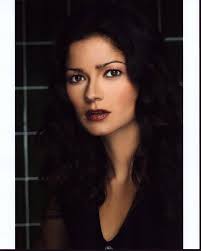 Posterazzi Jill Hennessy Headshot In Front Of Checkered Wall Photo Print  (16 x 20)