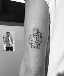 15 cool tattoos for dads that will give you ink inspiration. Tiny Fatherhood Tattoos Millions Grace Baby Tattoo Designs Father Tattoos Tattoos For Kids