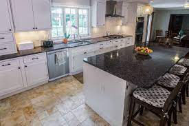 It helps to create more light in the kitchen rather than a wall and door. White Cabinets Paired With Dark Countertops Marble Com