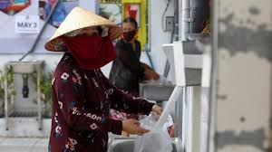 Vietnam S Rice Atms Help The Poor Affected By Virus Lockdown News Al Jazeera
