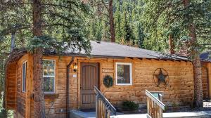This log cabin in estes park, colorado, offers 3 bedrooms, 2 baths, a large covered front porch, outstanding views, a fully furnished kitchen, laundry room, free 100mbps internet, 50+ inch smart tv in the living room, blue ray dvd players, and tv's in all bedrooms. The Inn On Fall River Estes Park Co