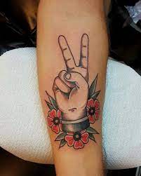 You may see a rose vine wrapping around the prongs with blossoms bursting at random spots; 101 Amazing Peace Tattoo Ideas That Will Blow Your Mind Outsons Men S Fashion Tips And Style Guide For 2020