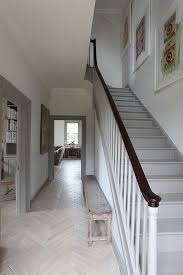 The New Look For Painted Trim Anything But White Hallway Flooring White Oak Floors Flooring Inspiration