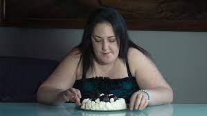 Obese woman choosing between healthy and unhealthy food. Hesitant Fat Woman Eats A Stock Footage Video 100 Royalty Free 10223057 Shutterstock