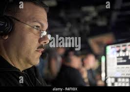 GULF OF MEXICO (Oct. 24, 2016) Lt. Cmdr. Patrick Earls, the combat systems  officer assigned to the pre-commissioning unit John Finn (DDG 113) operates  the tactical actions officer console during missile test