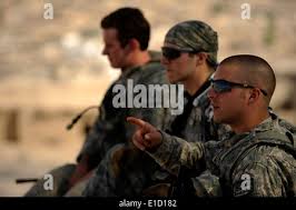 U.S. Army Staff Sgt. Manuel Salais, Iron Training Detachment Senior Air  Assault instructor and Cpl. Alexandra Perez, Iron Training Detachment Air  Assault instructor, perform inverted rappel techniques while U.S. Air Force  Master
