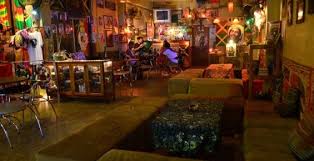 A groovy and colourful bar playing reggae music, with photos of bob marley and other legends of the genre on the walls. Pin On Rasta For I