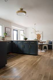 black kitchen cabinets, brass bar pulls