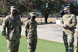 Brig. Gen. Ernest Litynski, Commanding General of the 85th U.S. Army  Reserve Support Command, promotes Command Sgt. Maj. Calvin Colin, CSM of  2-349 LSBN, as well presents coins to outstanding Soldiers within