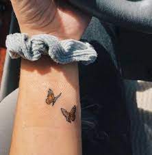 40 Cool Tattoo Ideas For Girls Who Want To Get Inked Homelovein Butterfly Wrist Tattoo Butterfly Tattoo Designs Butterfly Tattoos For Women