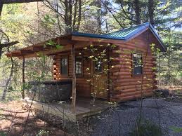 It is a rustic cabin with wood floors, but offers all modern amenities. Tiny Bear Log Cabin With A Hot Tub Cook Forest Fun Park Facebook