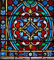 A mosaic is a pattern or image made of small regular or irregular pieces of colored stone, glass or ceramic, held in place by plaster/mortar, and covering a surface. Stained Glass Wikipedia