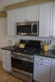 Photo Courtesy Of Lori Mounts Ksi Designer Merillat Classic Portrait In Cotton Cambria D Outdoor Kitchen Cabinets Merillat Kitchen Cabinets Kitchen Cabinets