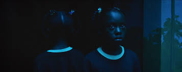 In the distance, a small town watches them in silence. Jordan Peele S Us Breaking Down The Twists And Endings Ew Com